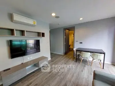 Modern living room with sleek furniture and wooden flooring