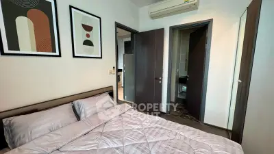 Modern bedroom with stylish decor and air conditioning in a contemporary apartment.