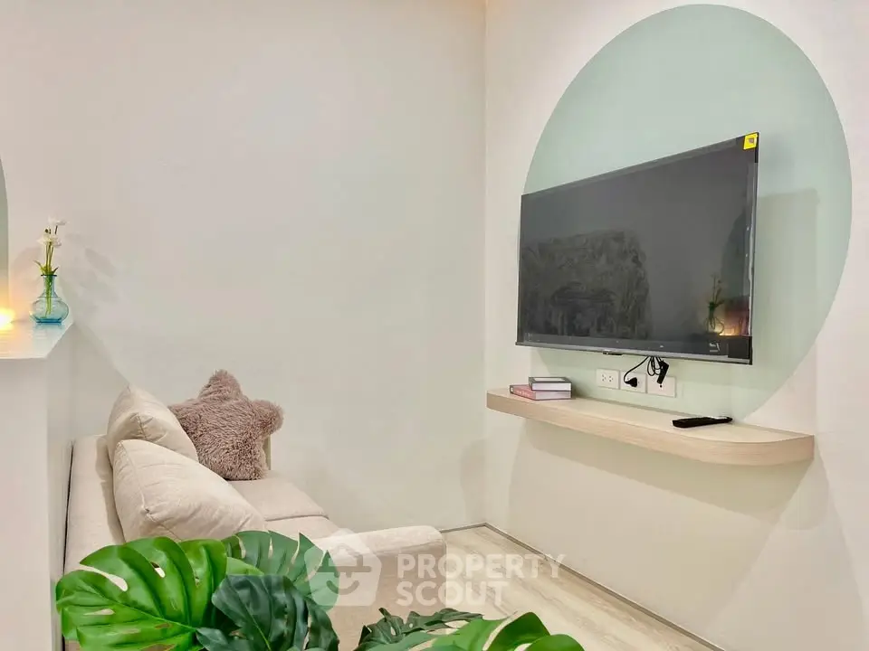 Cozy living room with modern TV setup and stylish decor