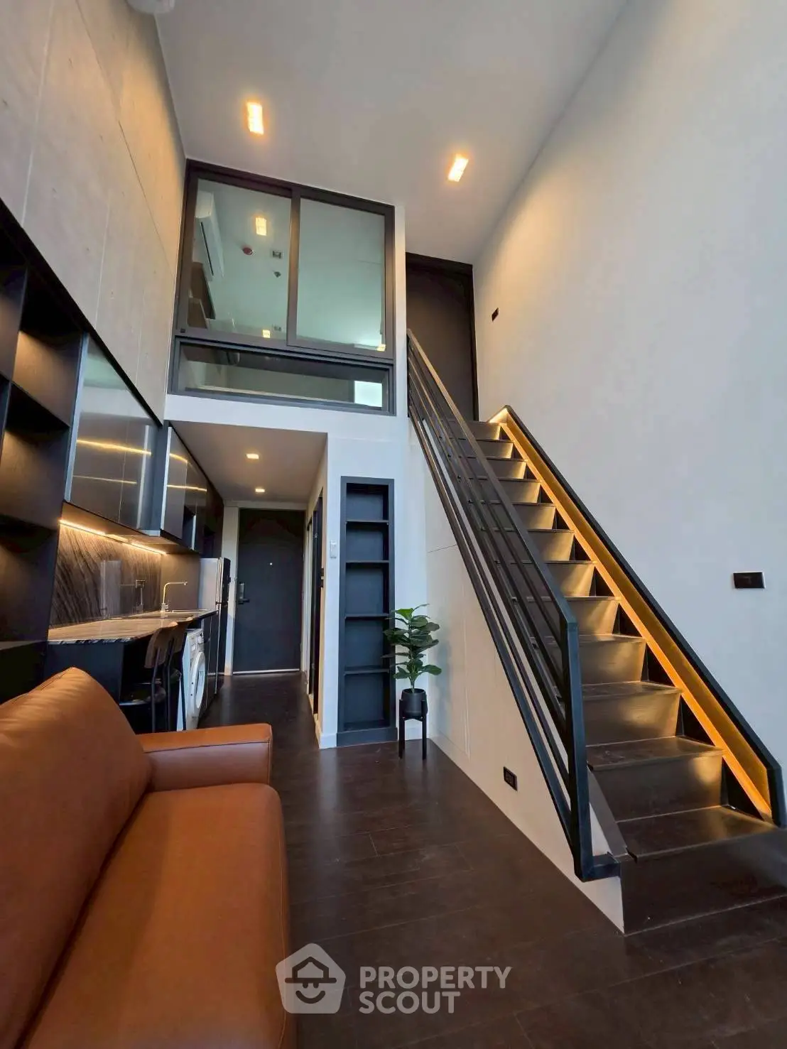 Modern loft apartment with sleek staircase and stylish interior design