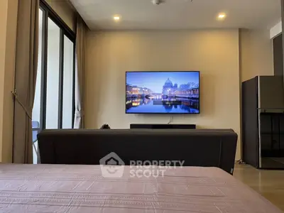 Modern living room with sleek TV setup and cozy ambiance