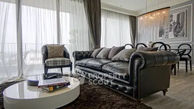 Luxurious living room with elegant leather sofa and chic chandelier