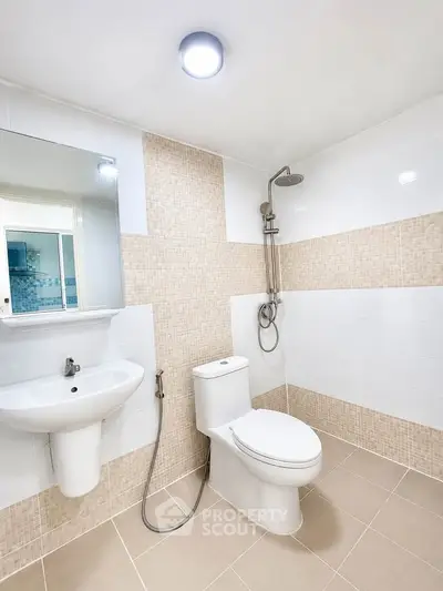 Modern bathroom with sleek fixtures and neutral tile design