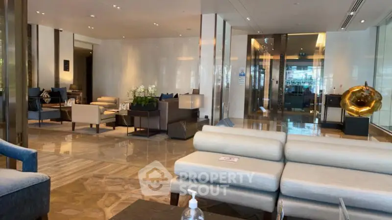 Luxurious modern lobby with elegant seating and decor, perfect for welcoming guests in style.