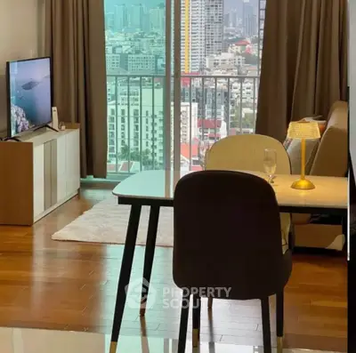 Modern living room with city view, stylish furniture, and elegant decor in a high-rise apartment.