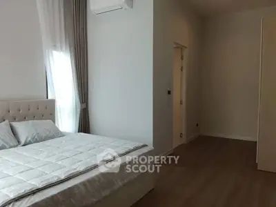 Spacious modern bedroom with elegant decor and natural light