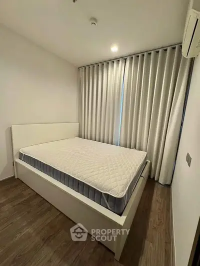 Cozy bedroom with modern design and ample natural light