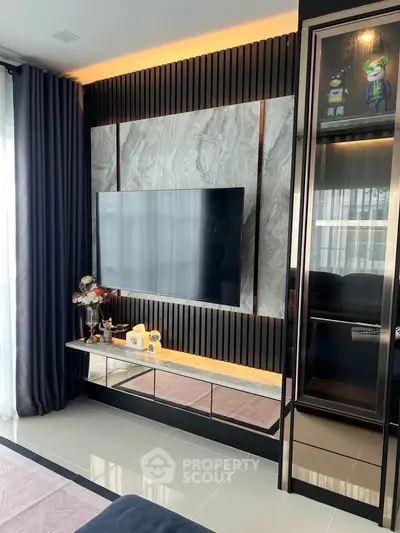Modern living room with sleek TV wall and elegant decor