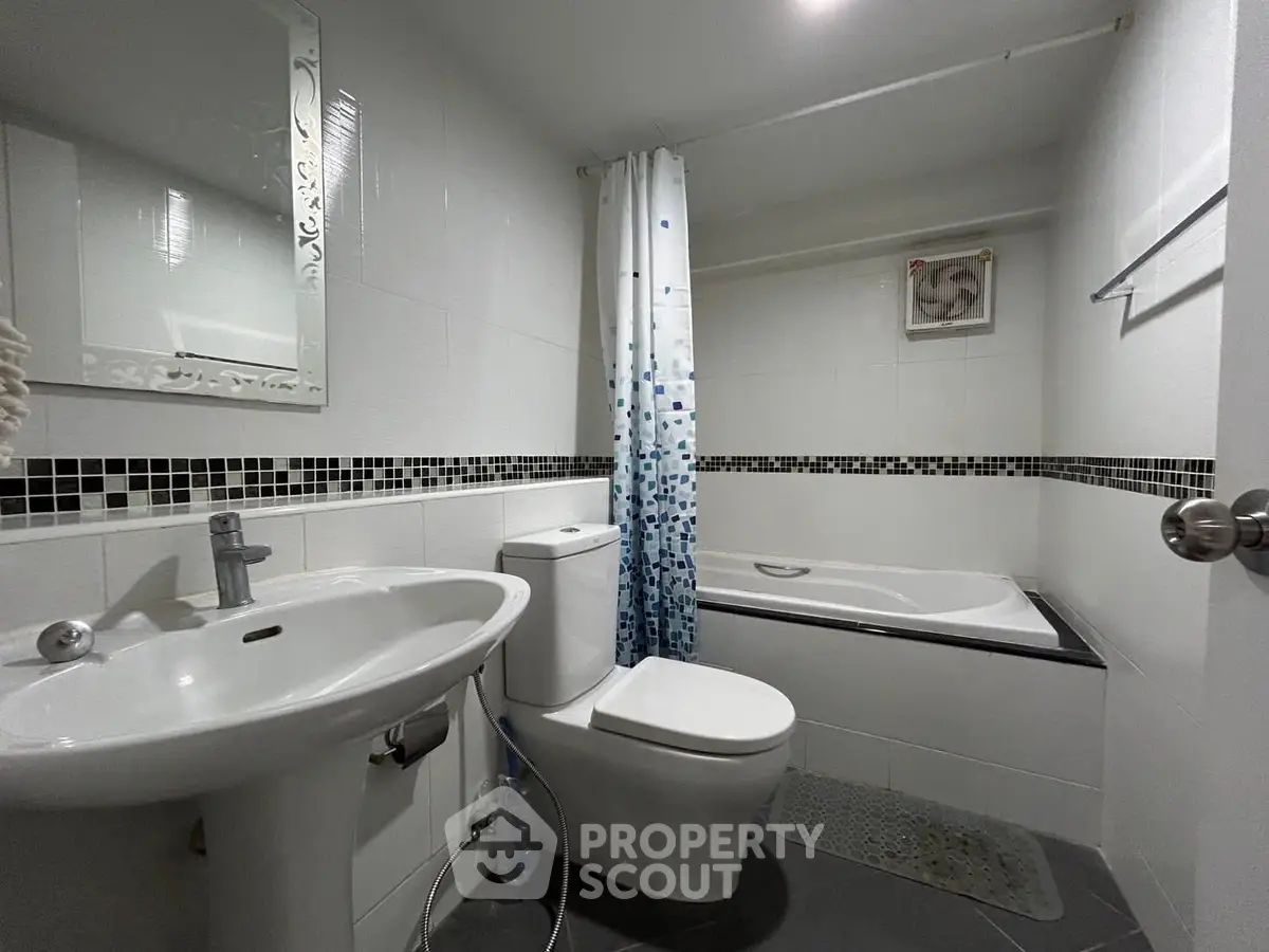 Modern bathroom with sleek fixtures and stylish tile accents