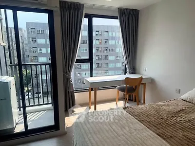 Modern bedroom with balcony view in urban apartment