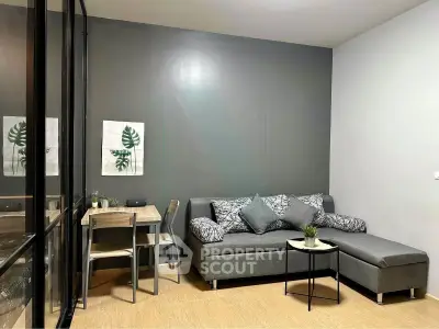 Modern living room with stylish gray sofa and chic decor