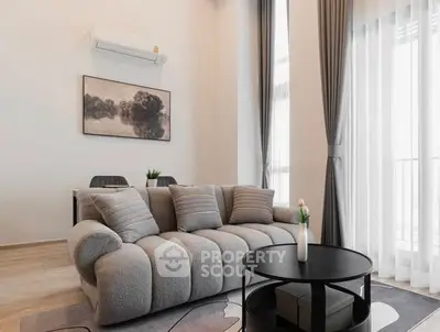 Modern living room with plush sofa and elegant decor