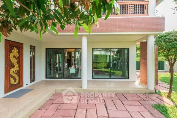 Charming modern home exterior with lush garden and unique dragon door design.