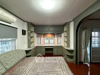 Spacious bedroom with built-in storage and elegant decor