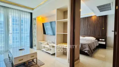 Modern apartment interior with stylish living room and cozy bedroom, featuring sleek furniture and natural light.