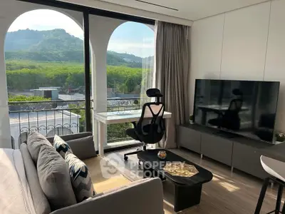 Modern living room with mountain view, large TV, and stylish furniture, perfect for relaxation and entertainment.