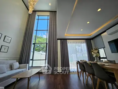 Spacious modern living room with high ceilings and elegant decor