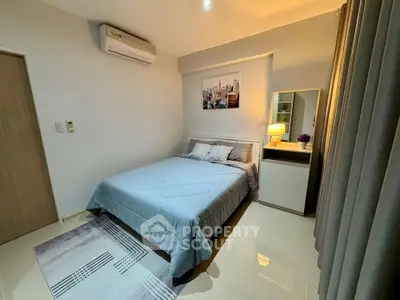 Modern bedroom with air conditioning and stylish decor in a cozy apartment.