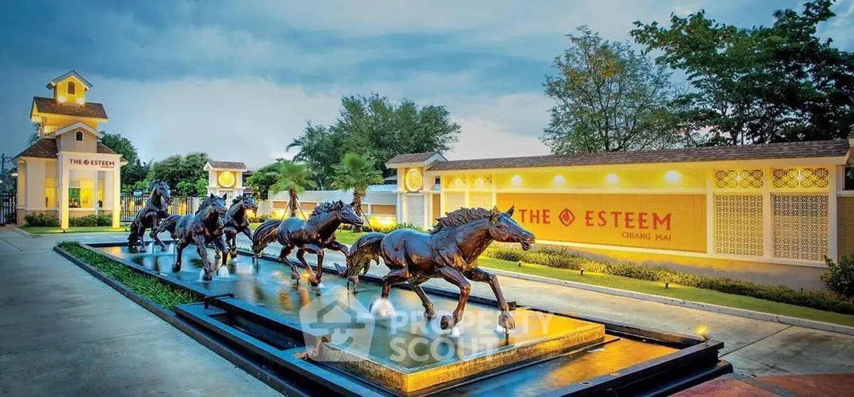 Stunning entrance of The Esteem Chiang Mai with horse sculptures and elegant landscaping.