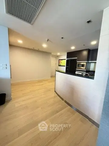 Modern kitchen with sleek appliances and open layout in a stylish apartment.