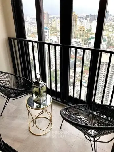 Stunning high-rise balcony with cityscape view, perfect for relaxation and enjoying urban living.