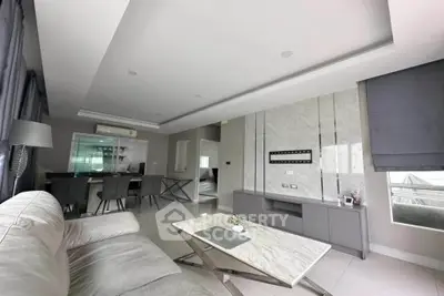 Modern living room with sleek marble accents and stylish furniture