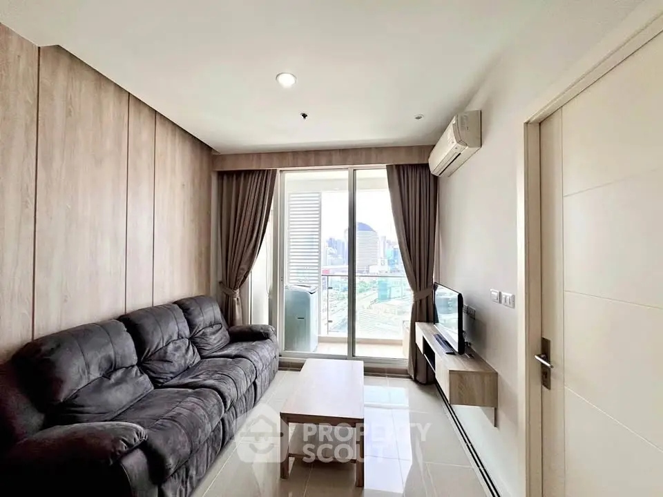 Modern living room with city view, sleek furniture, and natural light.