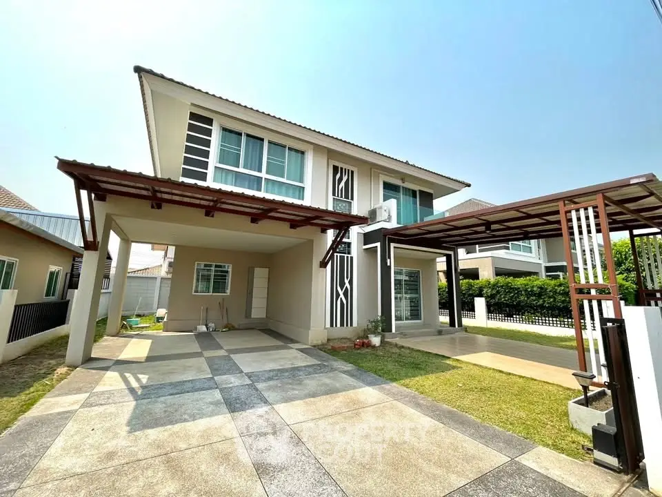 Modern two-story house with spacious driveway and contemporary design in a suburban neighborhood.