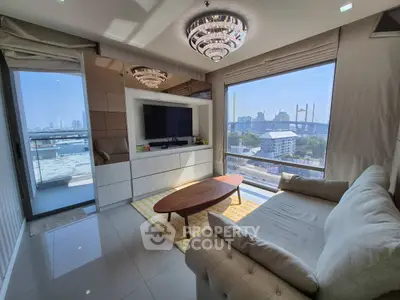 Luxurious living room with stunning city view and elegant chandelier lighting.