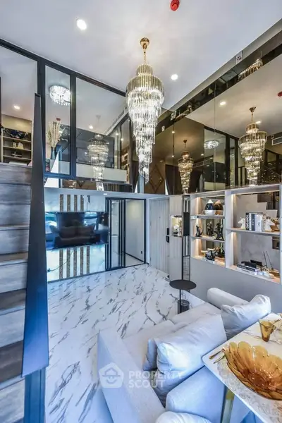 Luxurious modern living room with high ceilings, elegant chandeliers, and marble flooring in a stylish duplex apartment.