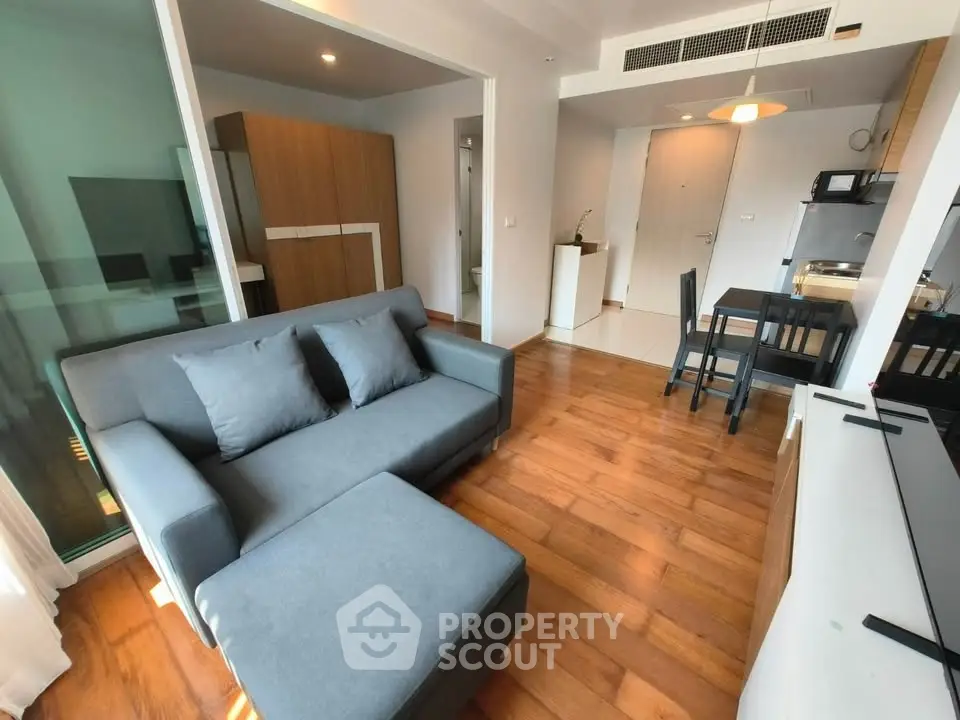 Modern living room with wooden flooring and stylish furniture