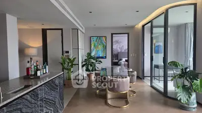 Luxurious modern living room with elegant decor and open layout, featuring a stylish bar area and contemporary furniture.