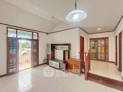 Spacious living room with modern design and ample natural light