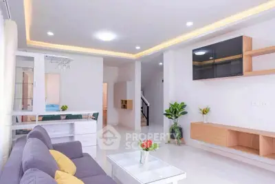 Modern living room with stylish furniture and elegant lighting