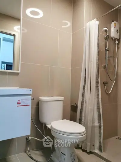 Modern bathroom with shower and toilet in sleek design