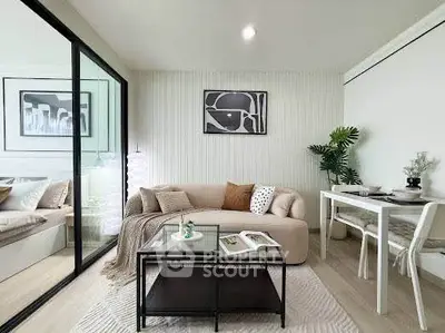 Modern living room with cozy sofa, stylish decor, and dining area in open layout apartment.