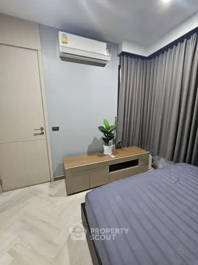 Modern bedroom with air conditioning and stylish decor