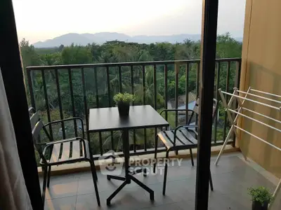 Charming balcony with scenic mountain view, perfect for relaxation and enjoying nature.