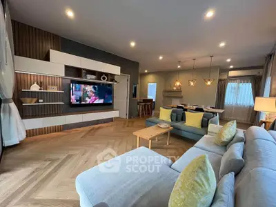 Spacious modern living room with stylish decor and cozy seating area, perfect for relaxation and entertainment.