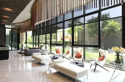 Luxurious modern living room with floor-to-ceiling windows and elegant decor