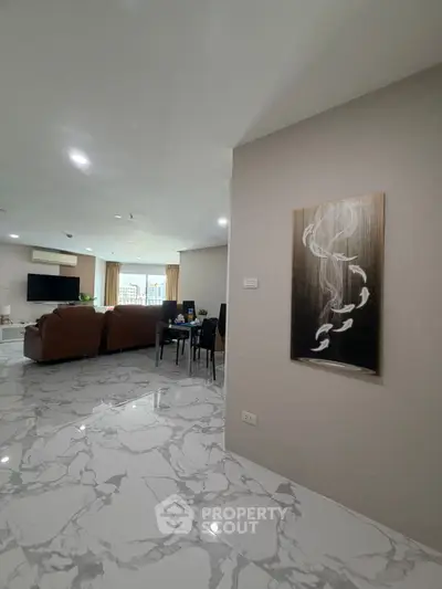 Spacious modern living room with elegant marble flooring and stylish decor