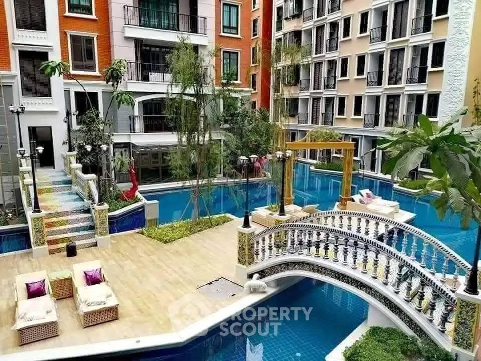 Luxurious residential complex with stunning pool and elegant bridge