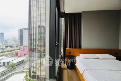 Modern bedroom with city view in high-rise apartment