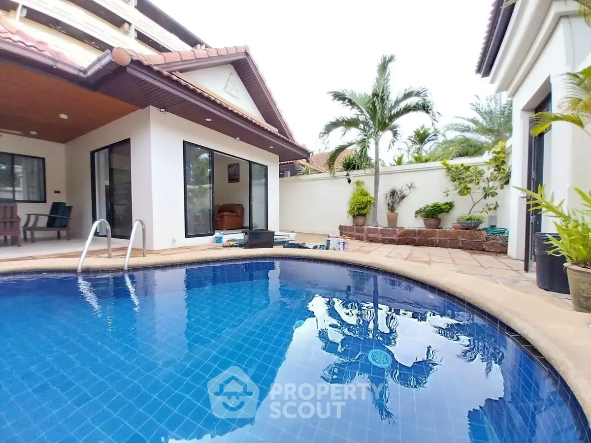 Luxurious villa with private pool and tropical garden, perfect for relaxation and entertaining.