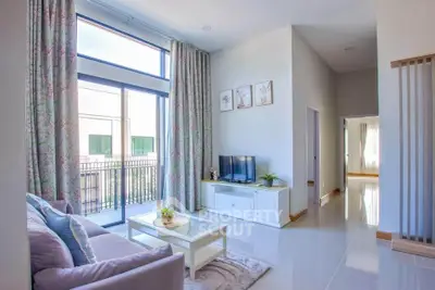 Bright and airy living room with modern decor and large windows