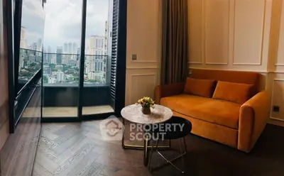 Chic living room with city view, featuring elegant parquet flooring and cozy sofa.