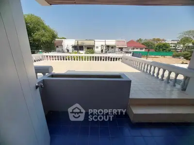 Spacious balcony with tiled flooring and scenic neighborhood view