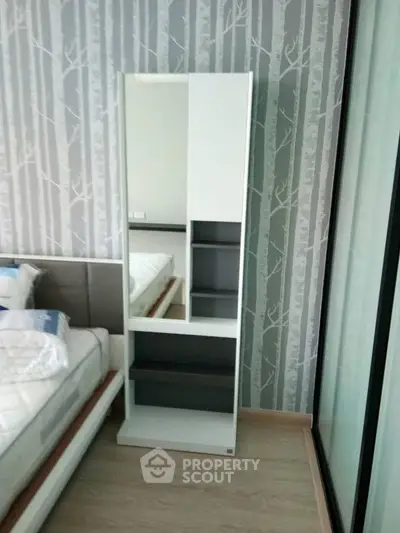 Modern bedroom with stylish wallpaper and sleek furniture design
