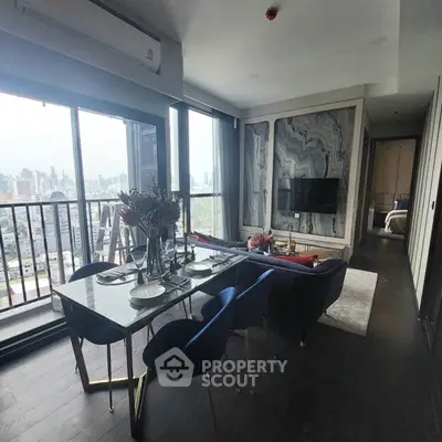 Luxurious living room with stunning city view and elegant dining area