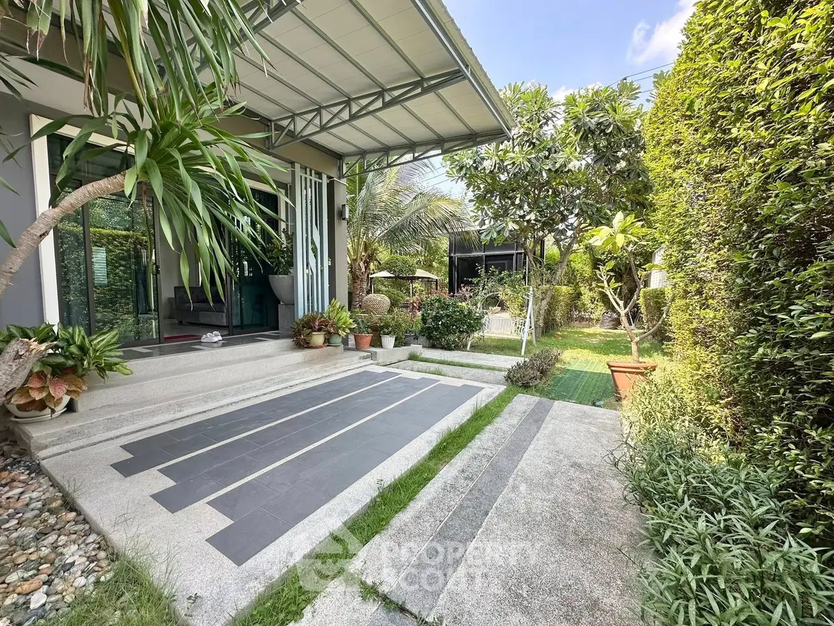 Charming garden entrance with lush greenery and modern design